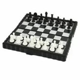 Chess set with black and white pieces on a checkered board
