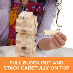 Person playing with a wooden block tower game, with text instructing to pull blocks out and stack carefully on top.