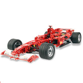 Technic Ferrari F1 racing car model in red with realistic detailing, large tires, and aerodynamic front wings.
