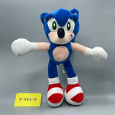 Blue plush toy with red and white shoes on a gray background, featuring a 'Toyland' tag.