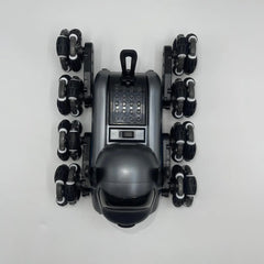 Top-down view of a black robot-like device with multiple wheels on a white background