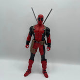 Action figure in a red and black costume with a white background