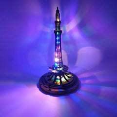 Minar e Pakista with colorful LED lights on a purple background