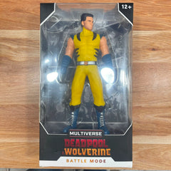 Multiverse Deadpool & Wolverine Battle Mode action figure in its original window box packaging, displayed on a wooden surface.