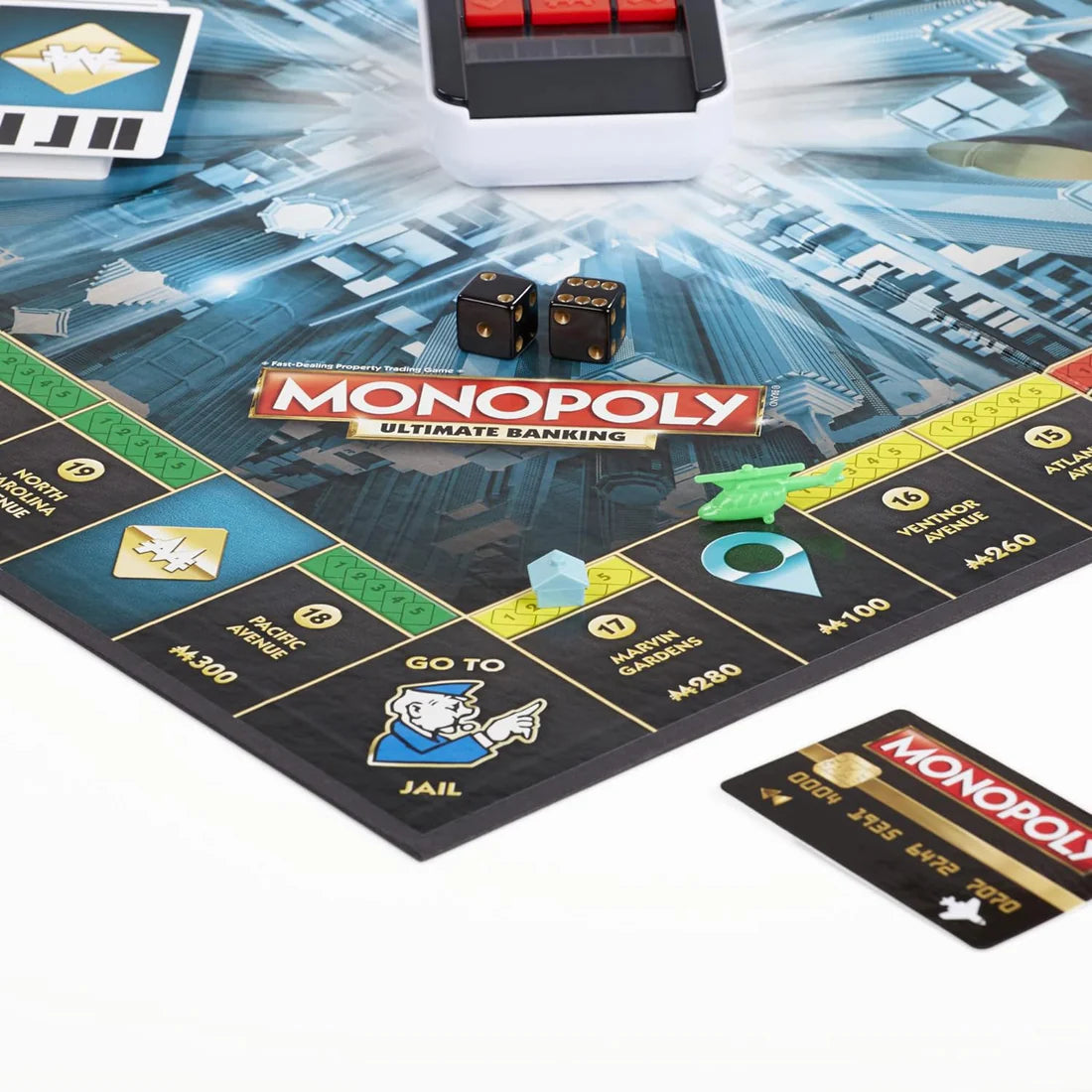 Monopoly game board with dice and cards on a white background