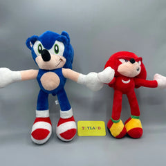 Two plush toys, one blue and one red, holding hands with a 'Toyland' label below on a gray background.