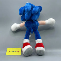 Blue plush toy with red and white accents on a gray background, featuring a 'Toyland' label.