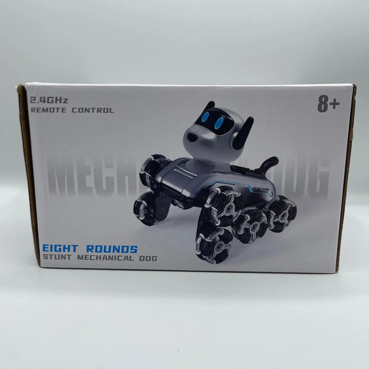 Box of a remote control mechanical dog toy on a white background