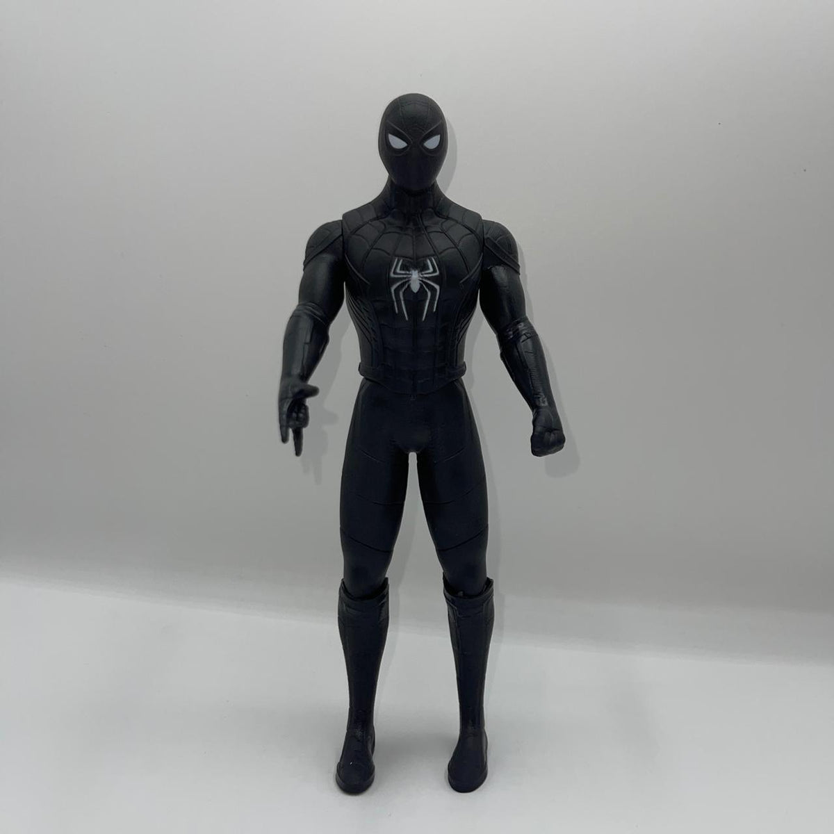 Black Spider-Man action figure on a white background