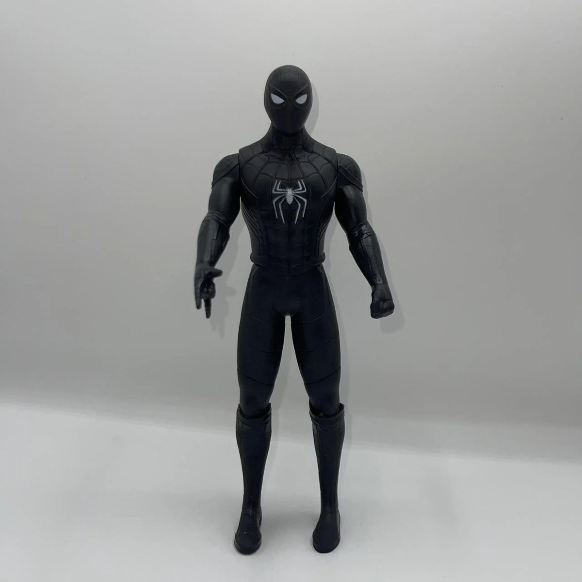 Black Spider-Man action figure on a white background