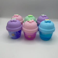 Set of colorful plastic containers with lids on a white background