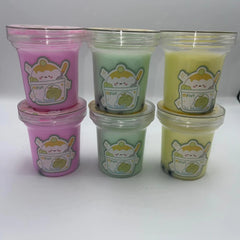 Set of six small cups, three pink and three green, with cartoon character designs on a white background.