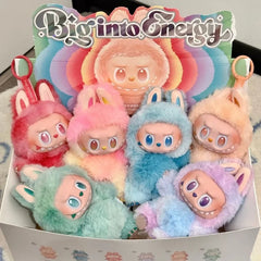 Colorful plush Labubu with a 'Big into Energy' sign in the background